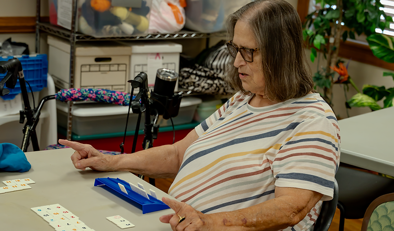 Seniors sharing conversation and joy at community center program